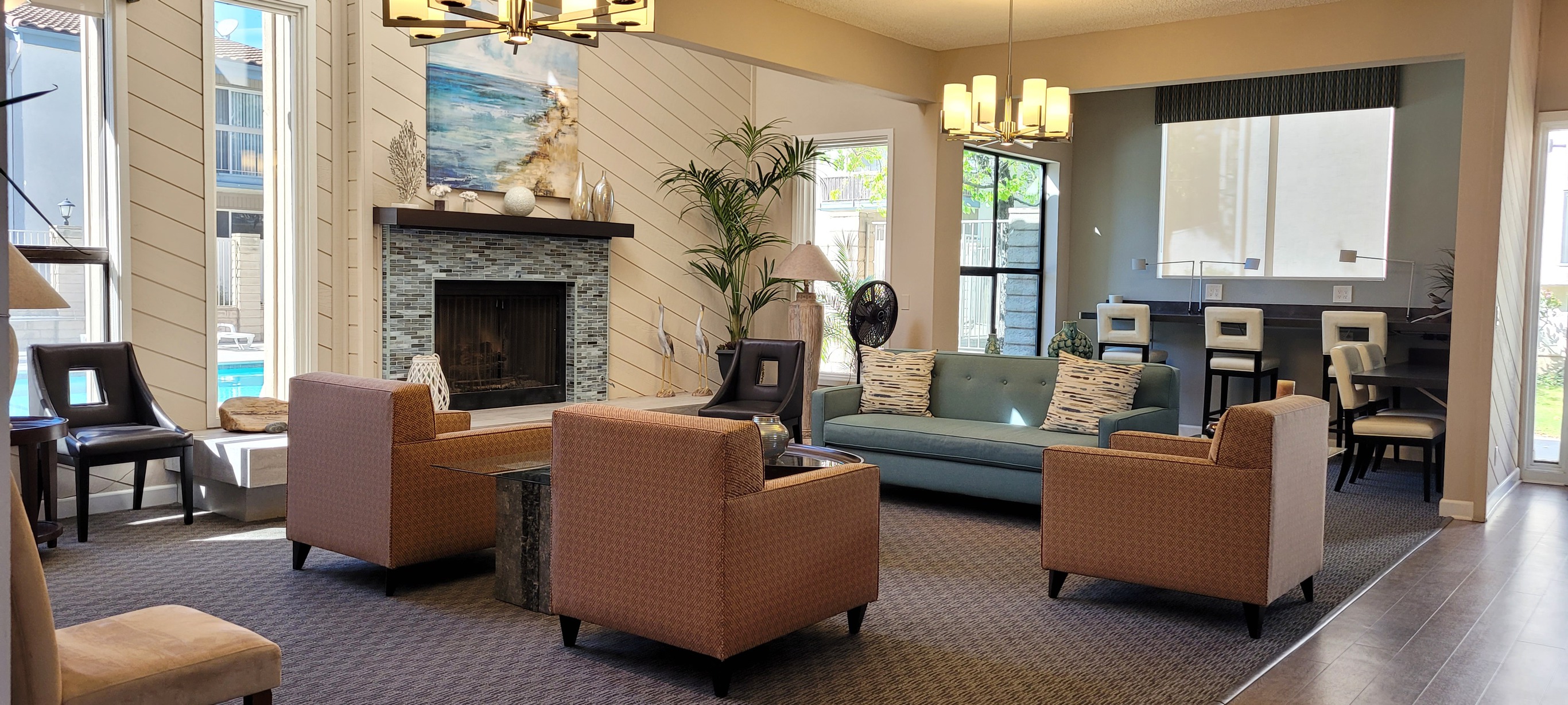 Ashwood Gardens community clubhouse with modern fireplace, office space and seating