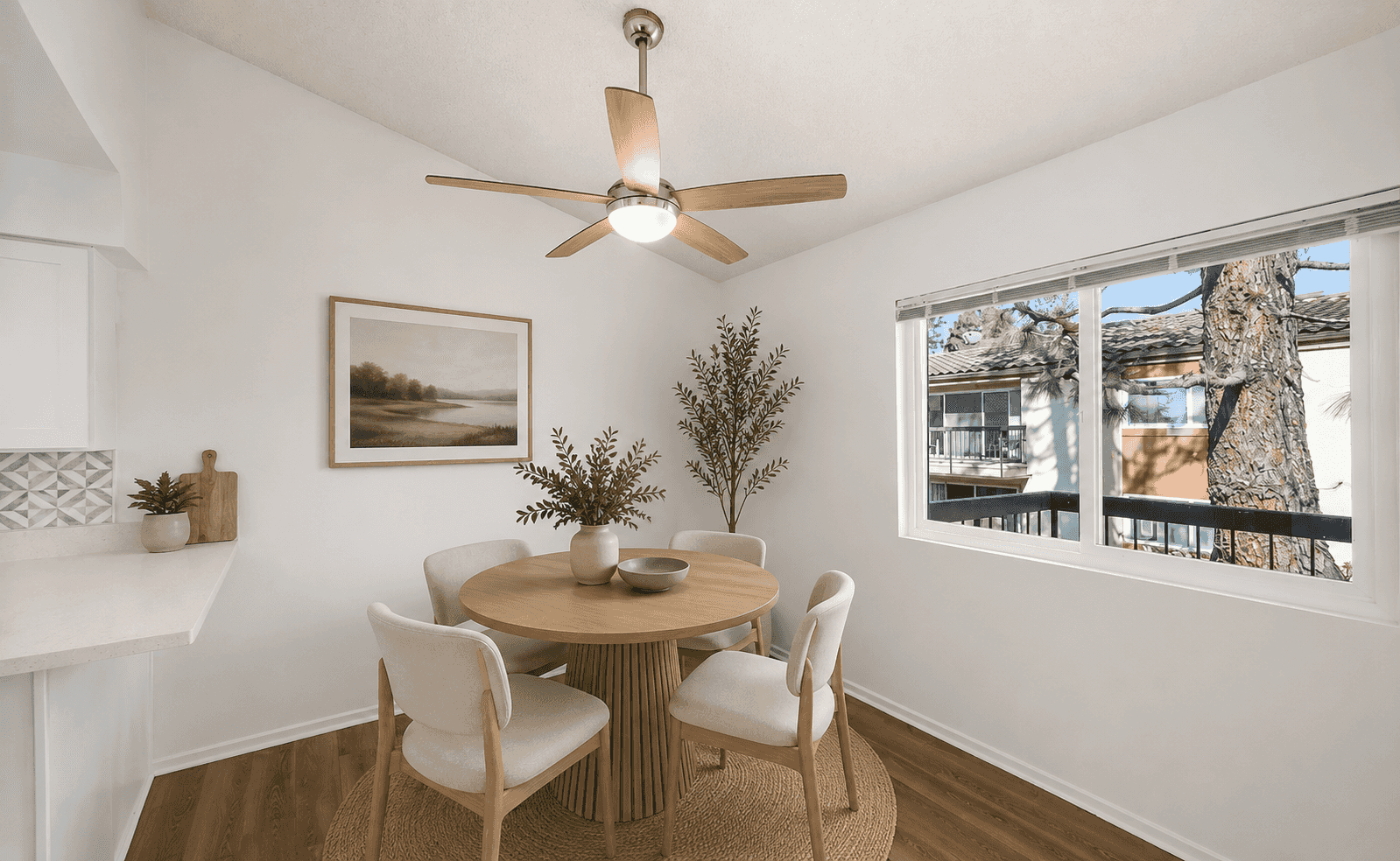 Bright dining nook with ceiling fan