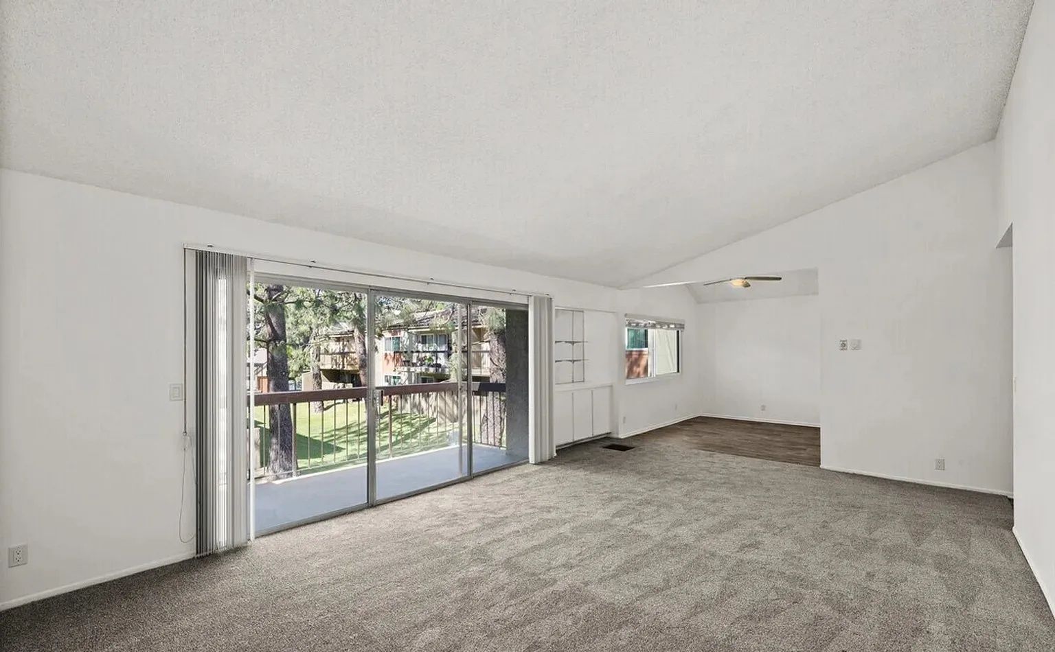 Ashwood Gardens Apartments spacious living room sliding glass door balcony